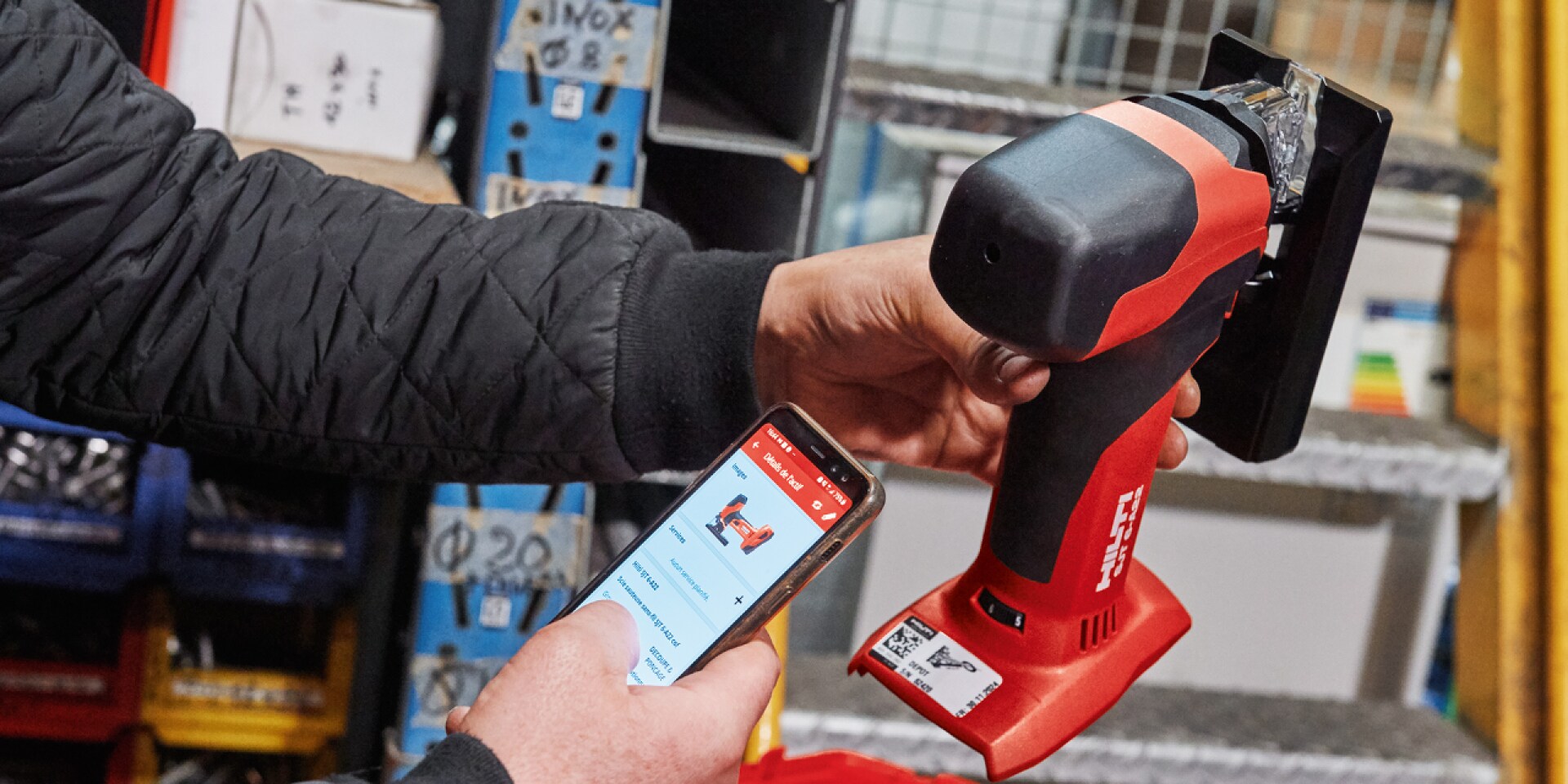 Person scanning a tool's QR code using the On!Track App 